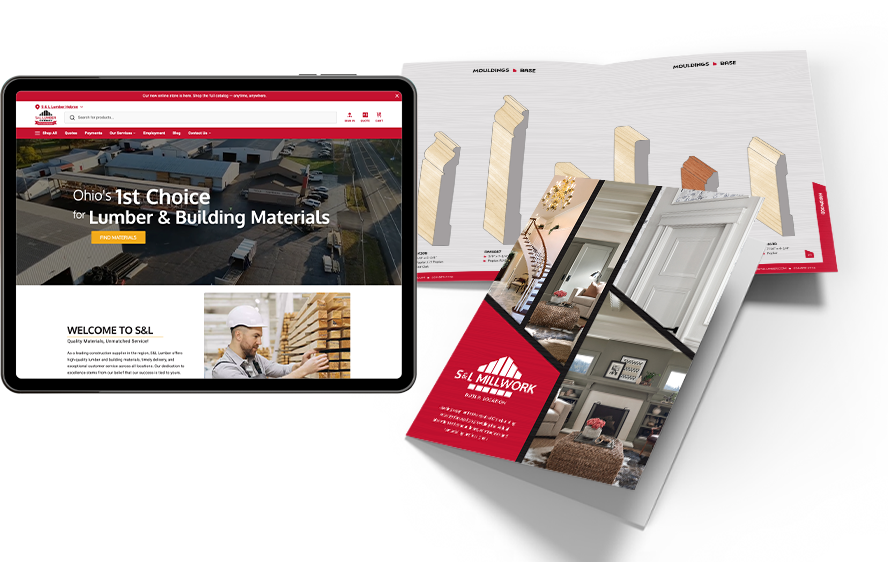Tablet shows a lumber and building materials website; printed catalogs with mouldings and interior images surround it.