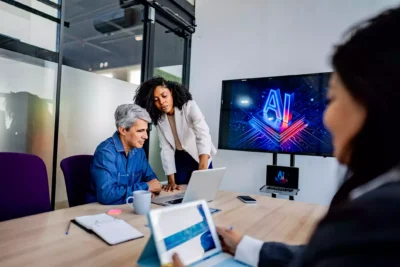 Marketing team reviewing AI-generated advertising content