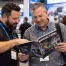 Manufacturing professionals networking through an association publication